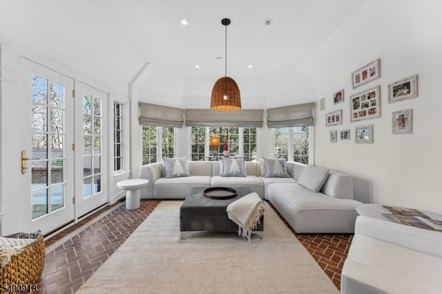 a spacious bathroom with a granite countertop sink mirror and double