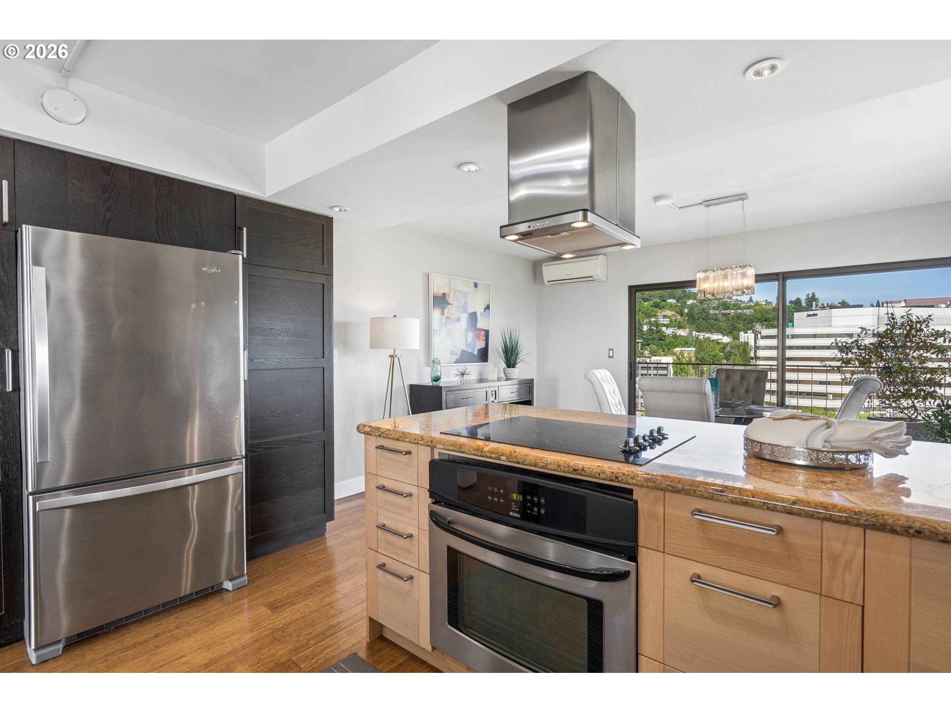 2211 Southwest 1st Avenue, Unit 1402 Portland, OR 97201 - Photo 22 of 48 a kitchen with a sink a refrigerator and window