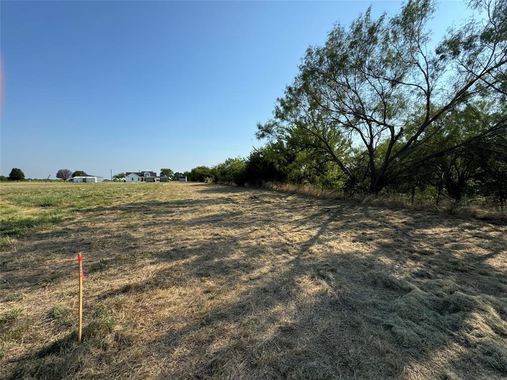 Tbd Lot 3 Old Tioga Road Gunter, TX 75058 - Photo 19 of 25 a view of a large body of water with a building in the background