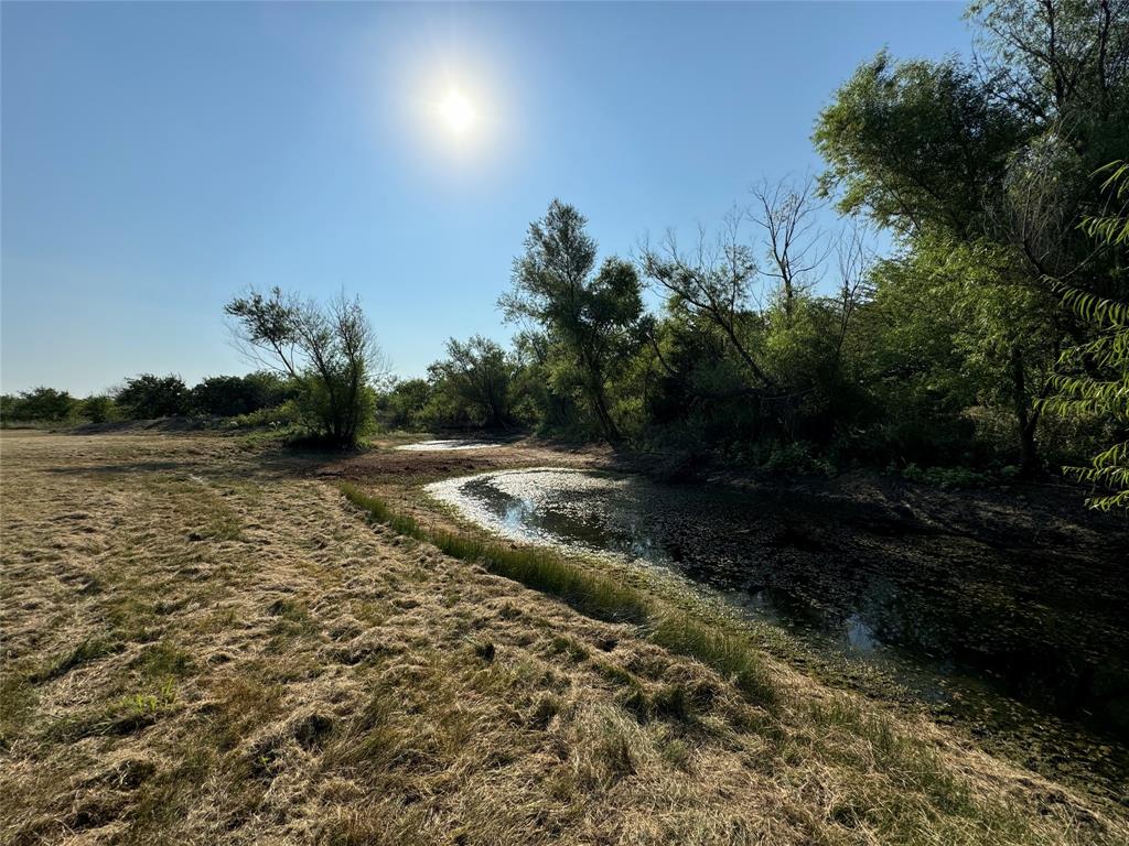 Tbd Lot 3 Old Tioga Road Gunter, TX 75058 - Photo 2 of 25 a view of a lake with a yard