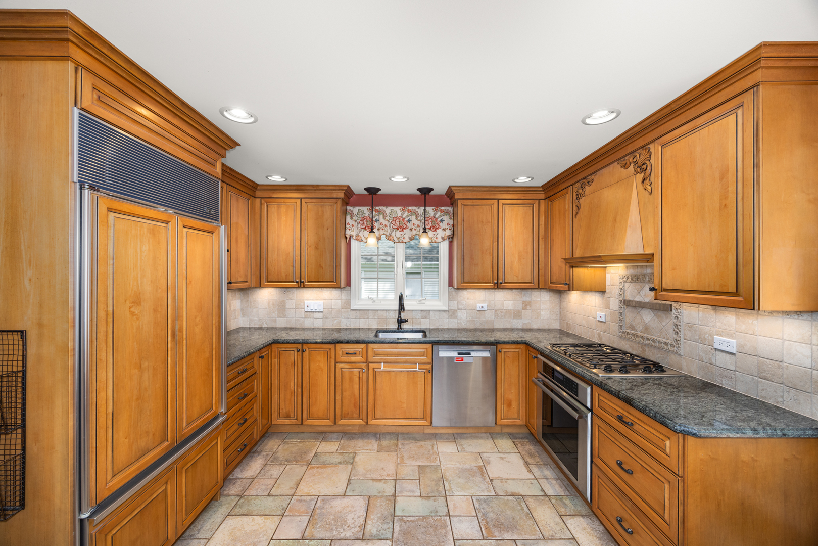 715 Smoke Tree Road Deerfield, IL 60015 - Photo 15 of 41 a kitchen with stainless steel appliances granite countertop a sink and cabinets