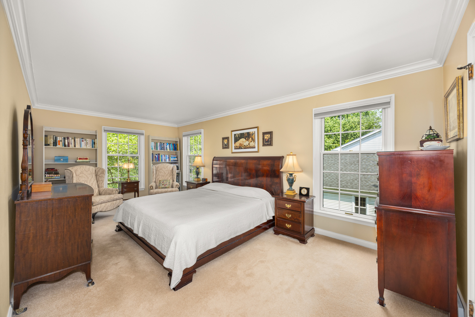 715 Smoke Tree Road Deerfield, IL 60015 - Photo 17 of 41 a bedroom with a bed and large windows