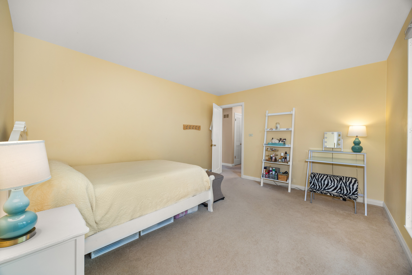 715 Smoke Tree Road Deerfield, IL 60015 - Photo 23 of 41 a bedroom with a bed and a cabinets
