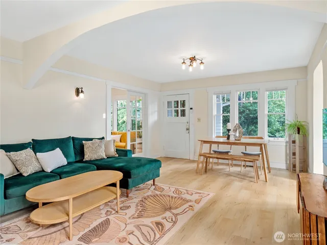 a living room with furniture and a window