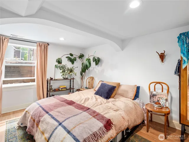 a bedroom with bed and a window