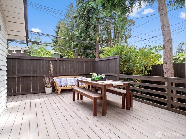 a view of a wooden deck with furniture