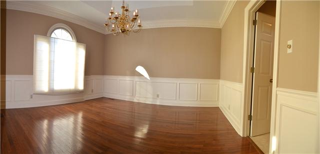 487 Pond Apple Road Clarksville, TN 37043 - Photo 8 of 19 Beautiful formal dining room with Lovely Crown Molding with dentils, Handsome hardwood floors and wainscoat.