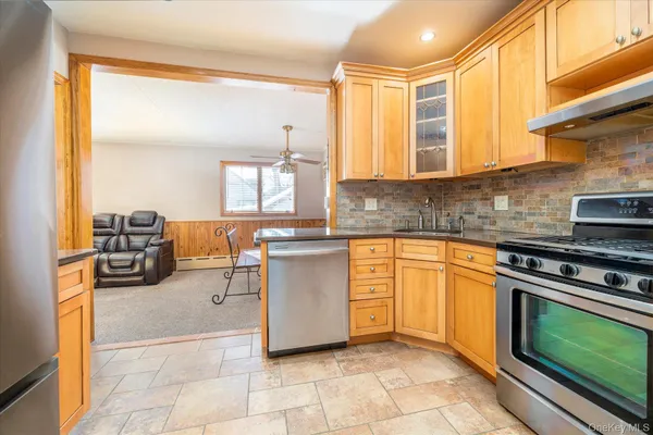 a kitchen with cabinets and appliances
