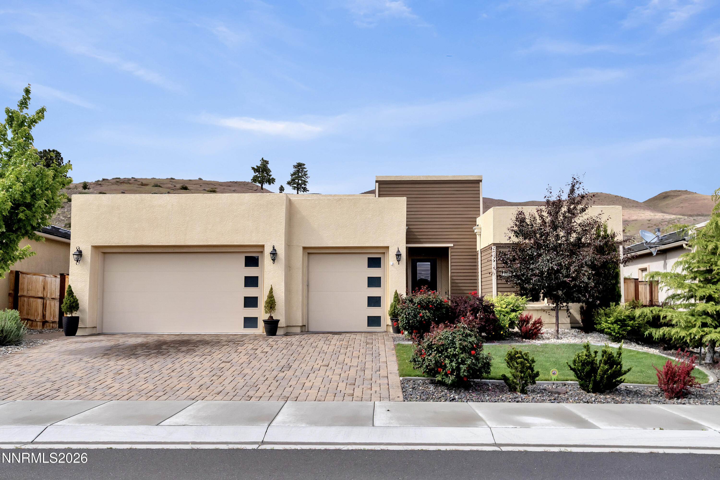 9021 Iron Sky Court Reno, NV 89523 - Photo 4 of 39 a front view of house with a garden