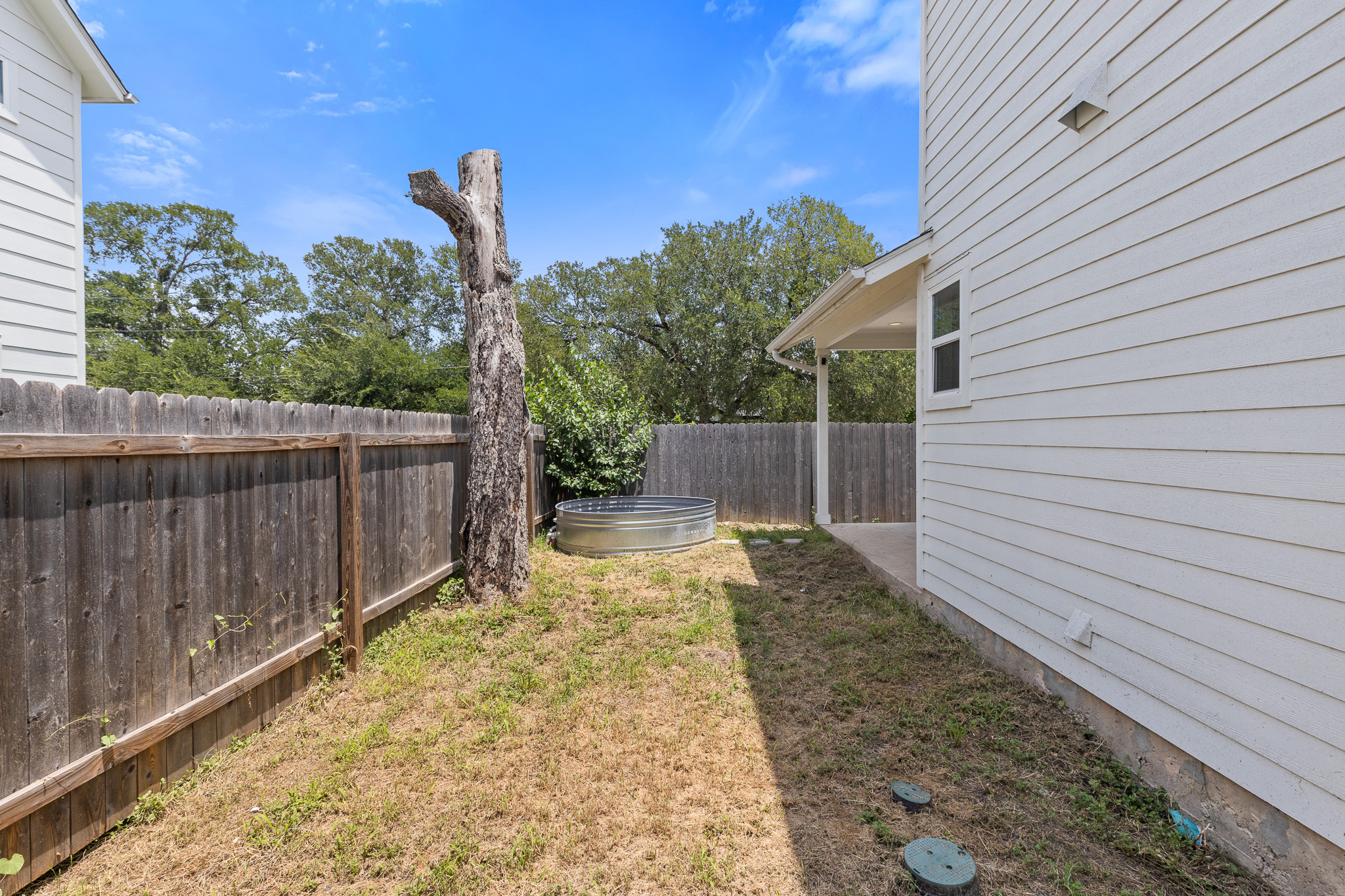 2604 Wheless Lane, Unit 1 Austin, TX 78723 - Photo 32 of 38 Fenced yard ensures privacy and security for family and pets.