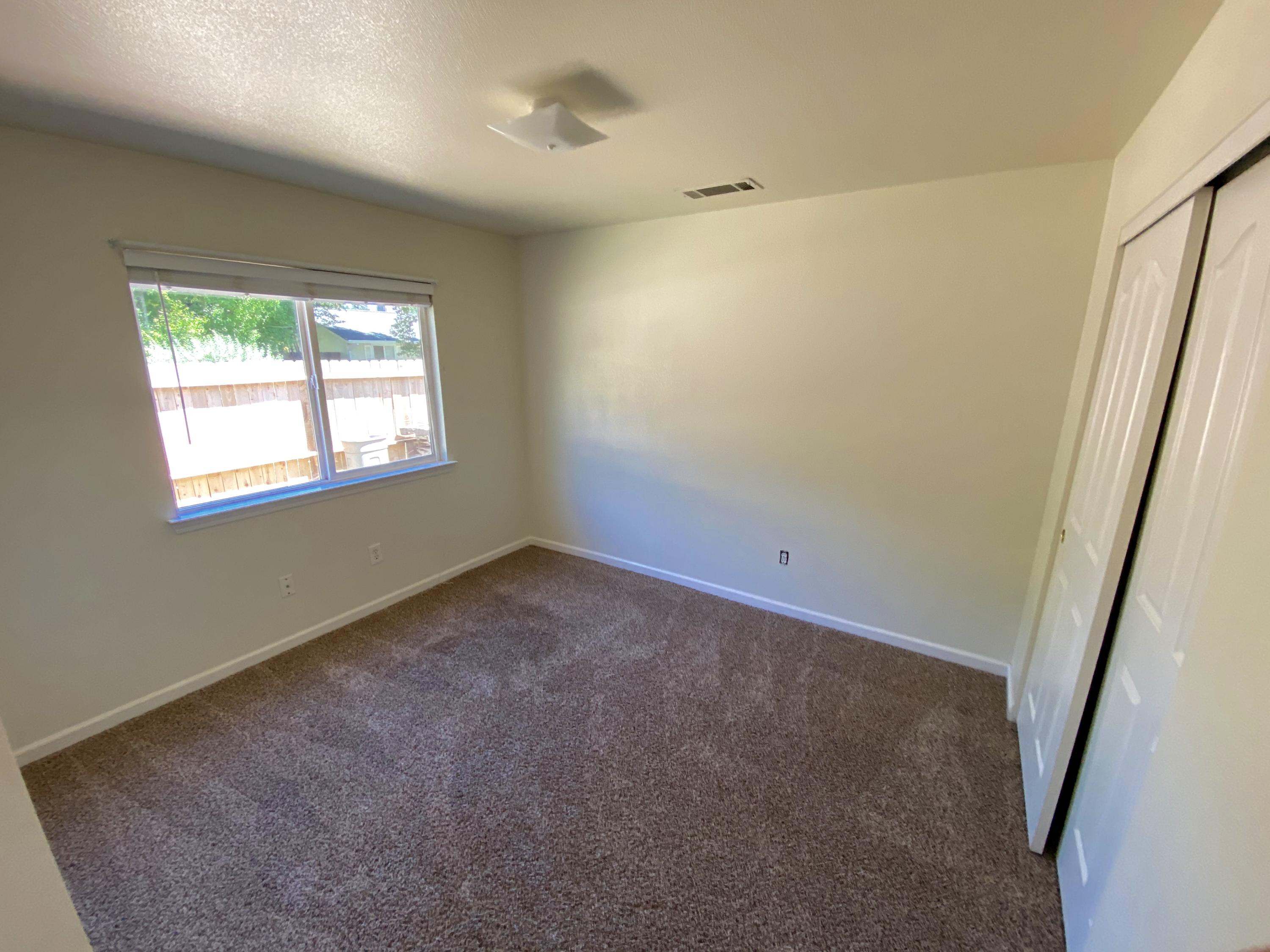 5378 Cedars Road Redding, CA 96001 - Photo 16 of 23 a view of an empty room with a window