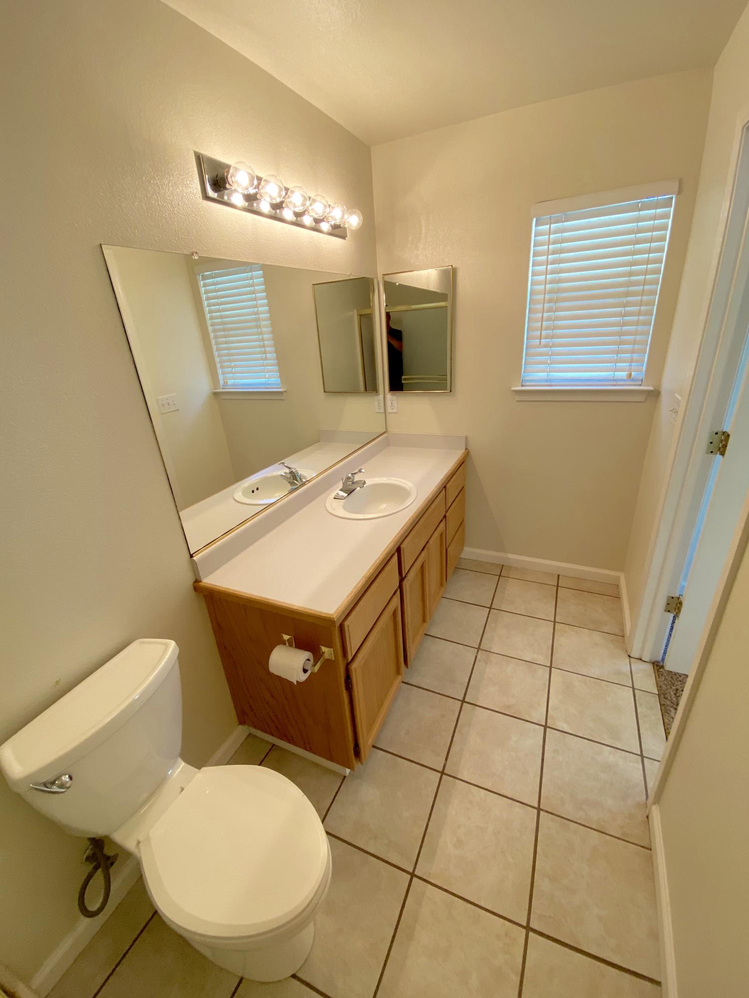 5378 Cedars Road Redding, CA 96001 - Photo 18 of 23 a bathroom with a sink toilet and mirror
