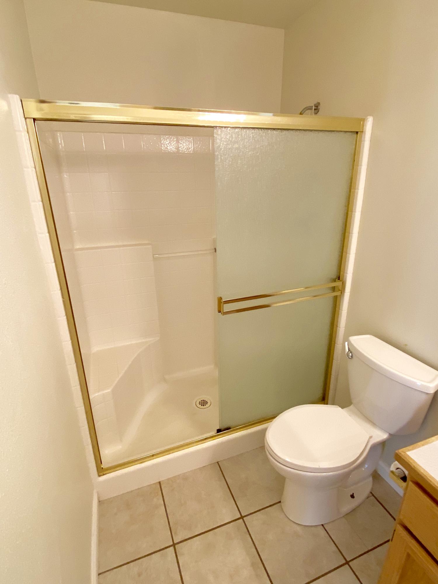 5378 Cedars Road Redding, CA 96001 - Photo 19 of 23 a bathroom with a toilet and a shower