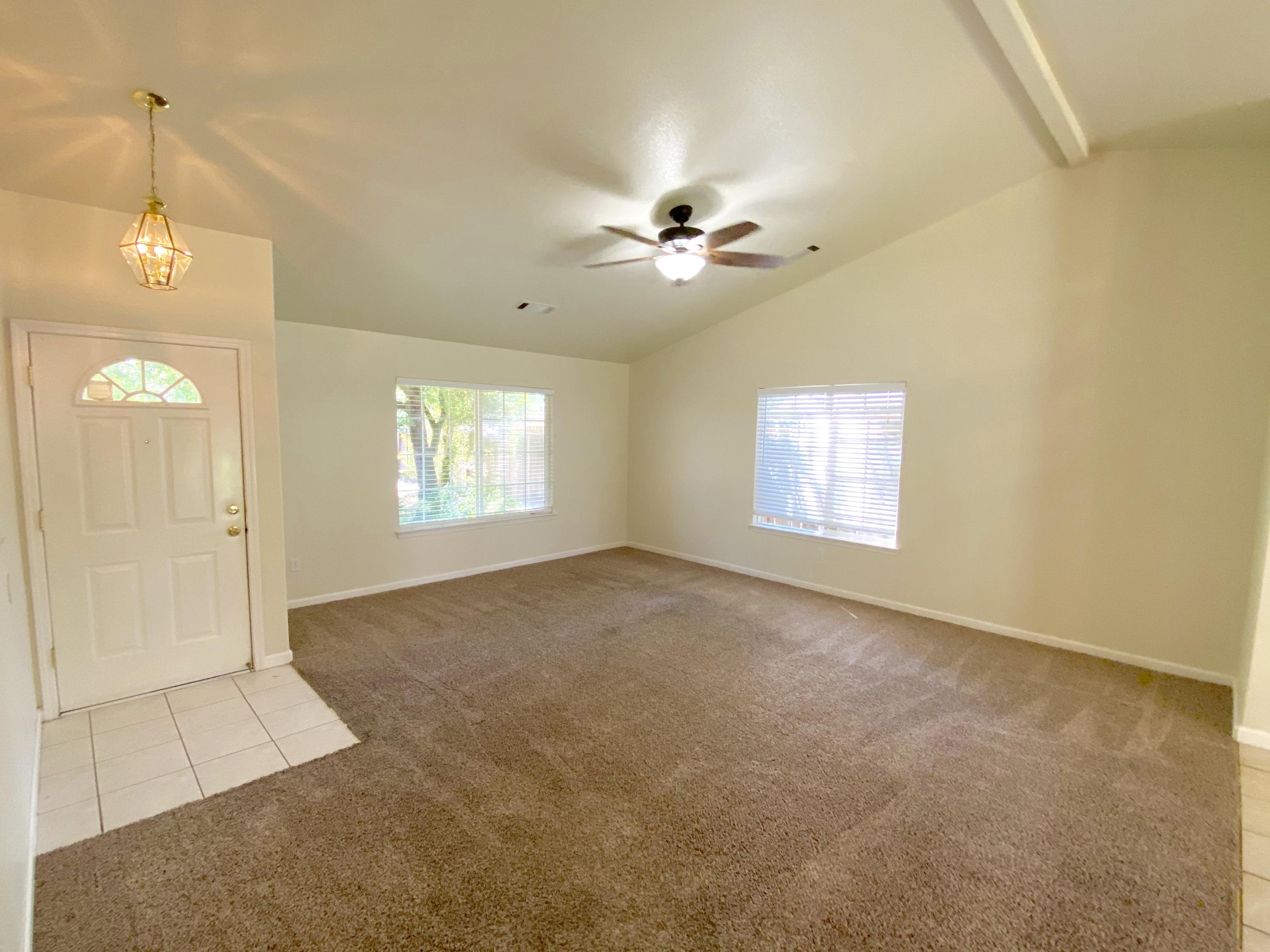 5378 Cedars Road Redding, CA 96001 - Photo 4 of 23 a view of an empty room with a window