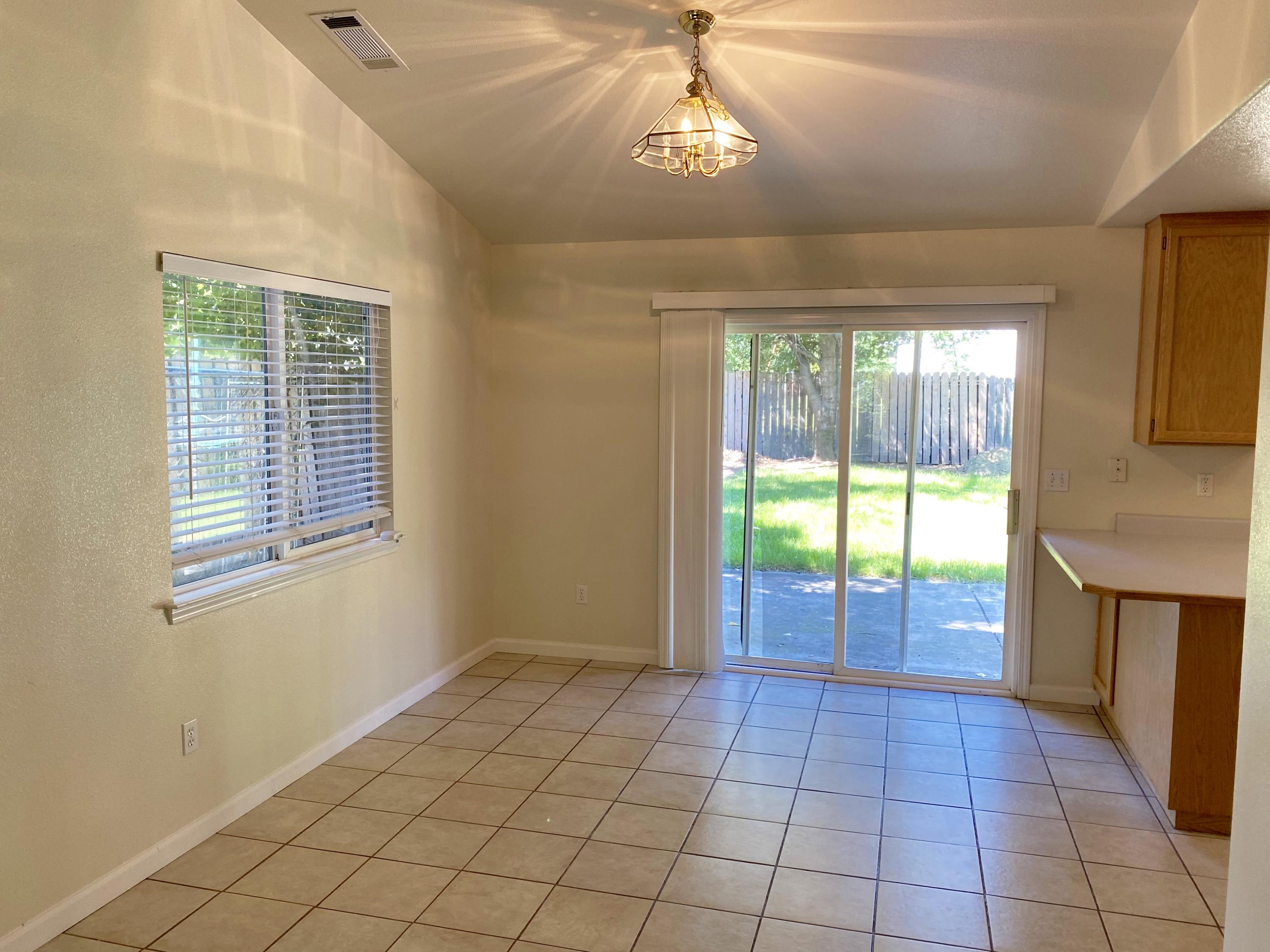 5378 Cedars Road Redding, CA 96001 - Photo 8 of 23 a view of an empty room with a window