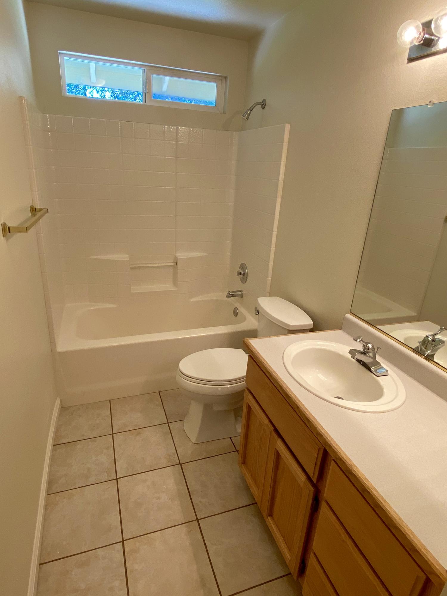 5378 Cedars Road Redding, CA 96001 - Photo 9 of 23 a bathroom with a sink a toilet and shower