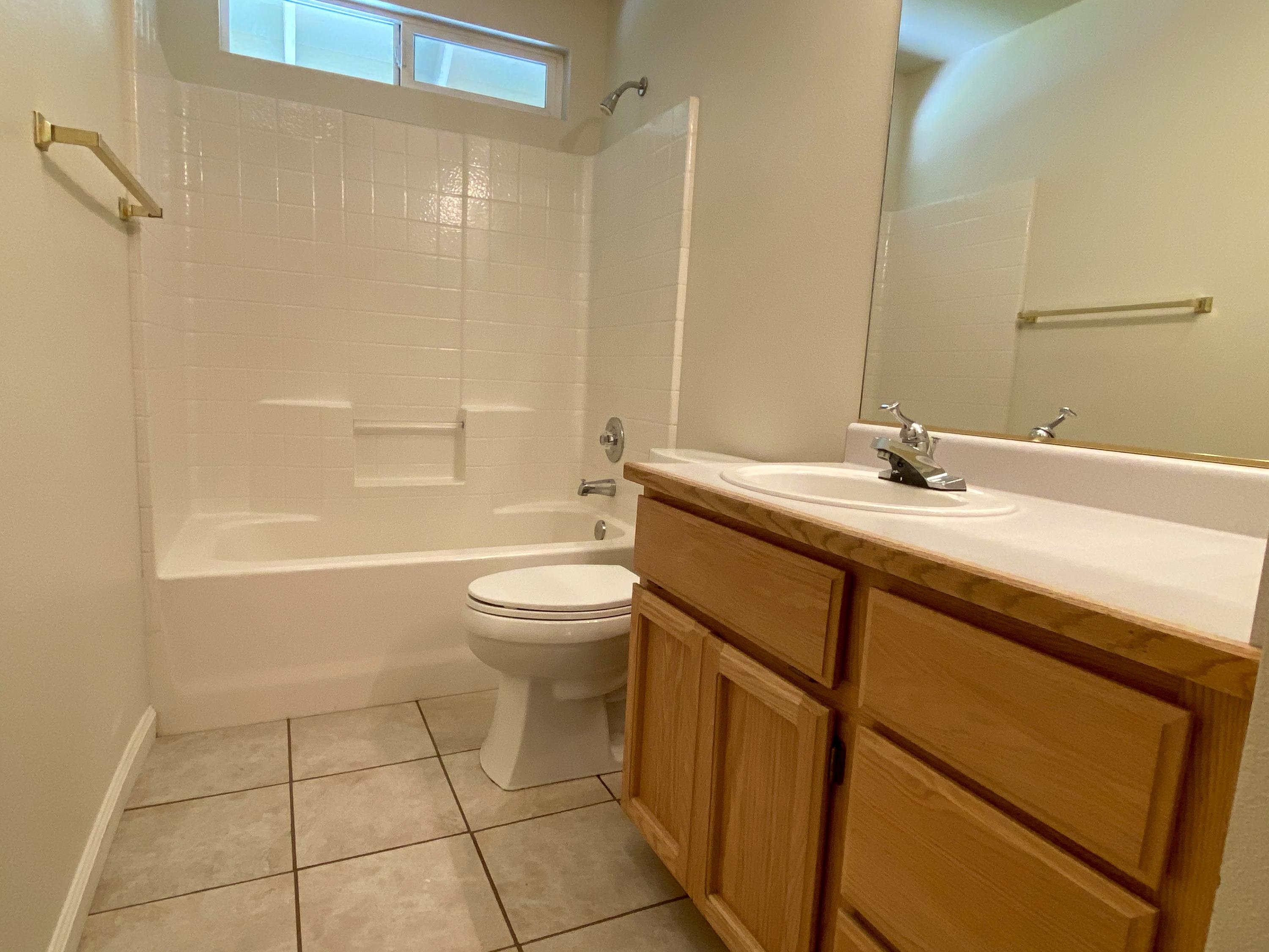 5378 Cedars Road Redding, CA 96001 - Photo 10 of 23 a bathroom with a sink a toilet and shower