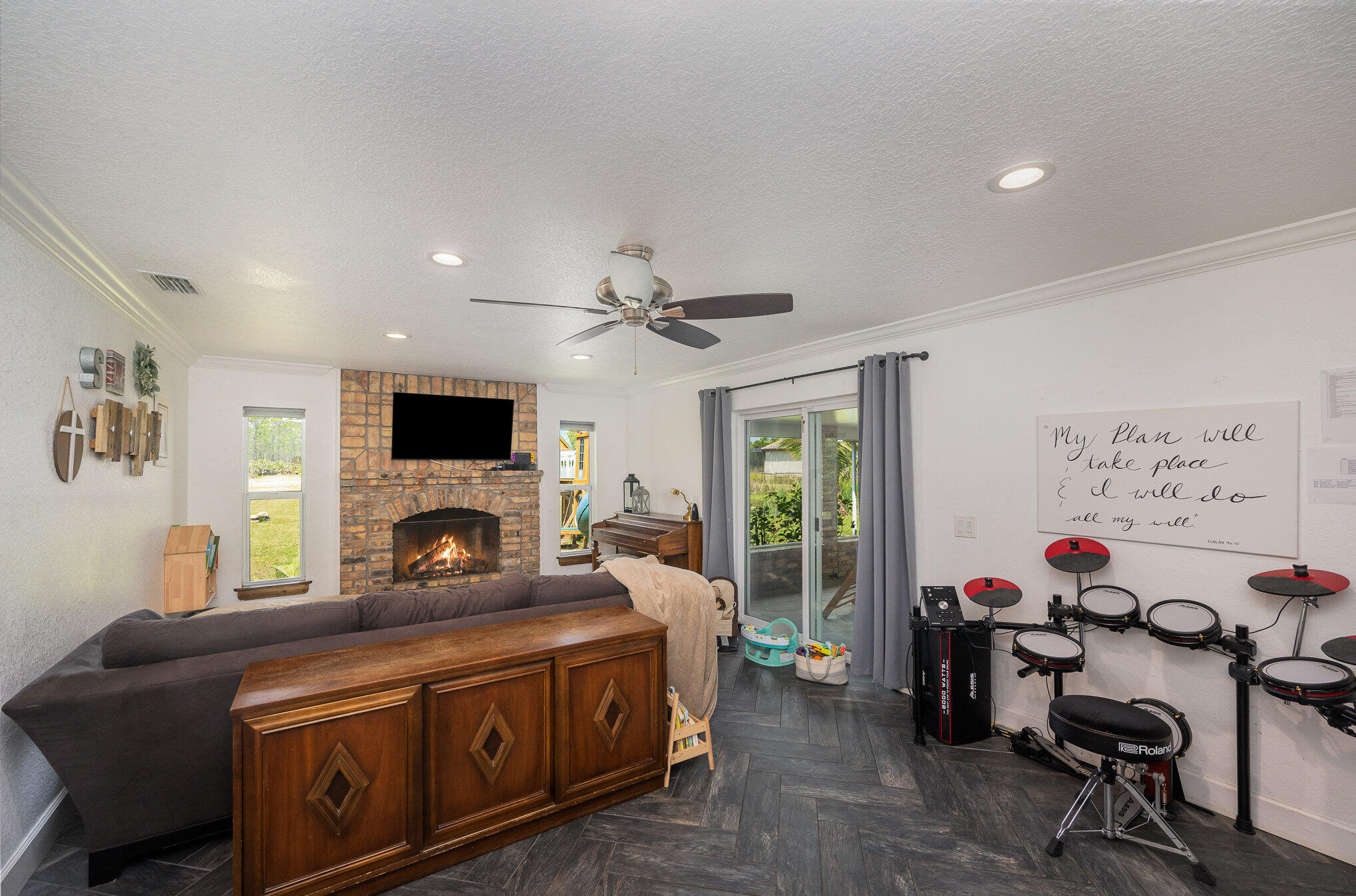 3650 Corey Road Malabar, FL 32950 - Photo 9 of 40 a living room with furniture and a flat screen tv