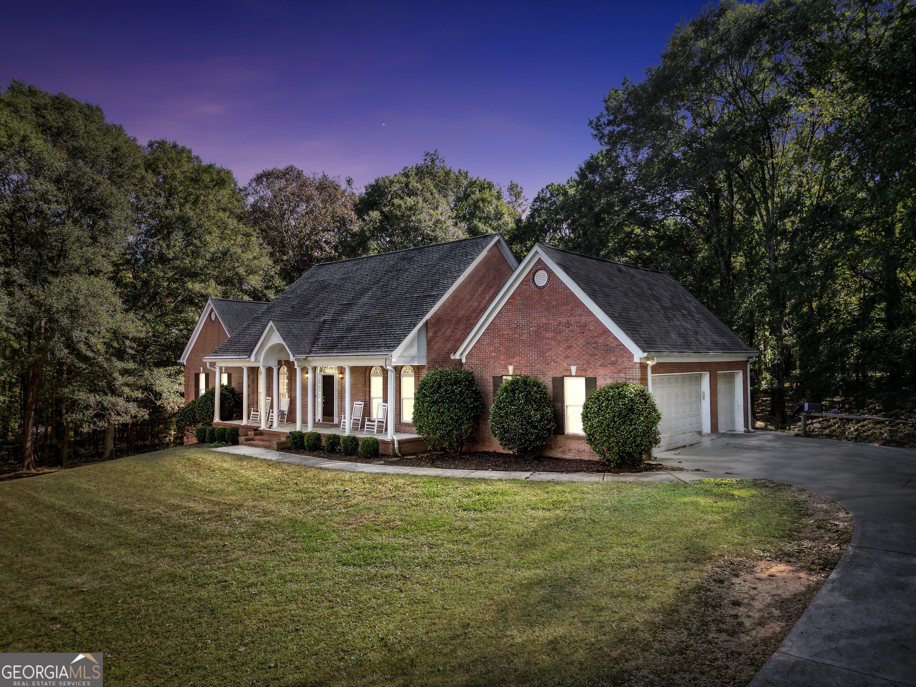 261 Highway 85 Connector Brooks, GA 30205 - Photo 2 of 73 a front view of a house with a yard