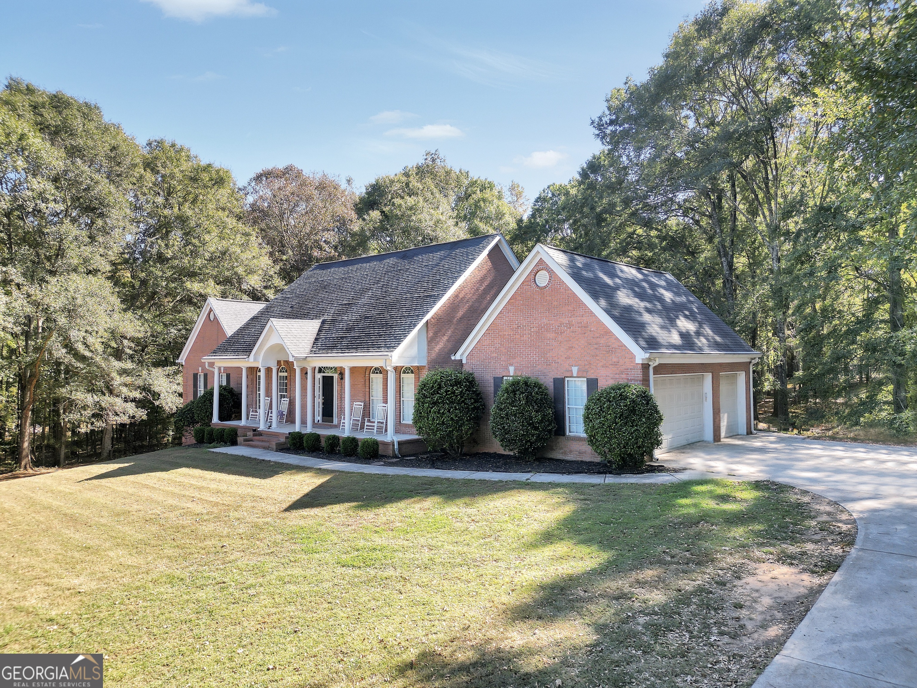 261 Highway 85 Connector Brooks, GA 30205 - Photo 3 of 73 a front view of house with yard and trees around