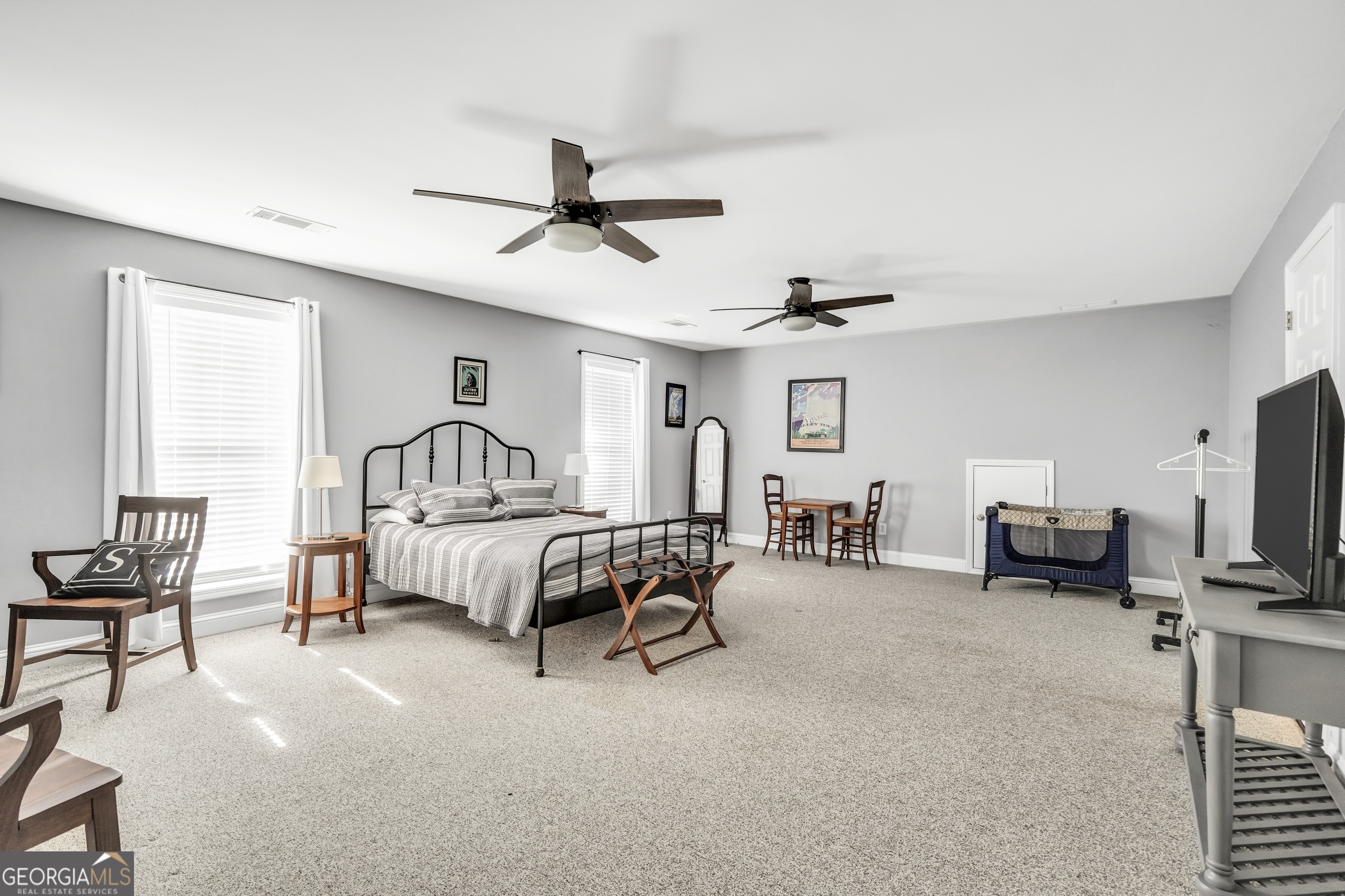 261 Highway 85 Connector Brooks, GA 30205 - Photo 32 of 73 a bedroom with furniture and a flat screen tv