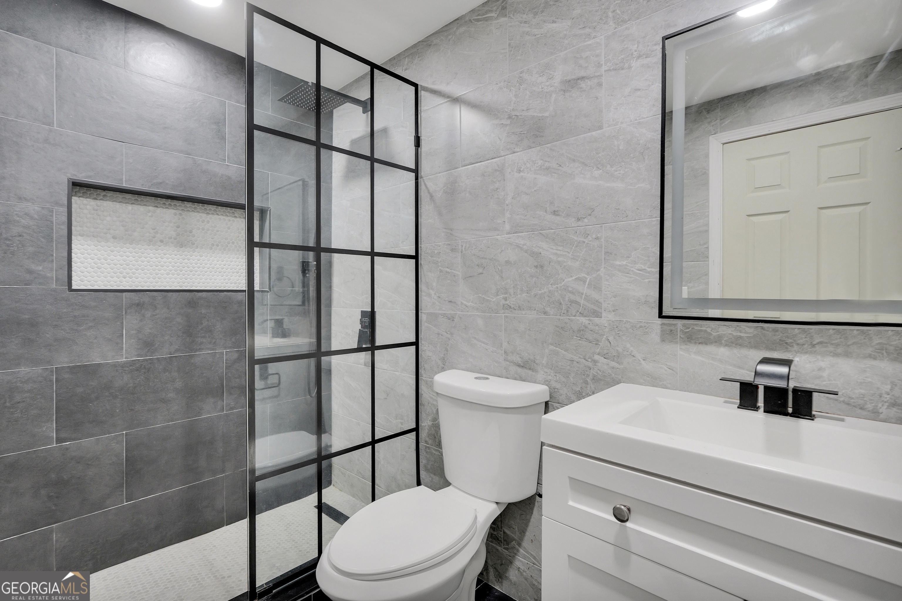 261 Highway 85 Connector Brooks, GA 30205 - Photo 41 of 73 a bathroom with a toilet a sink and shower