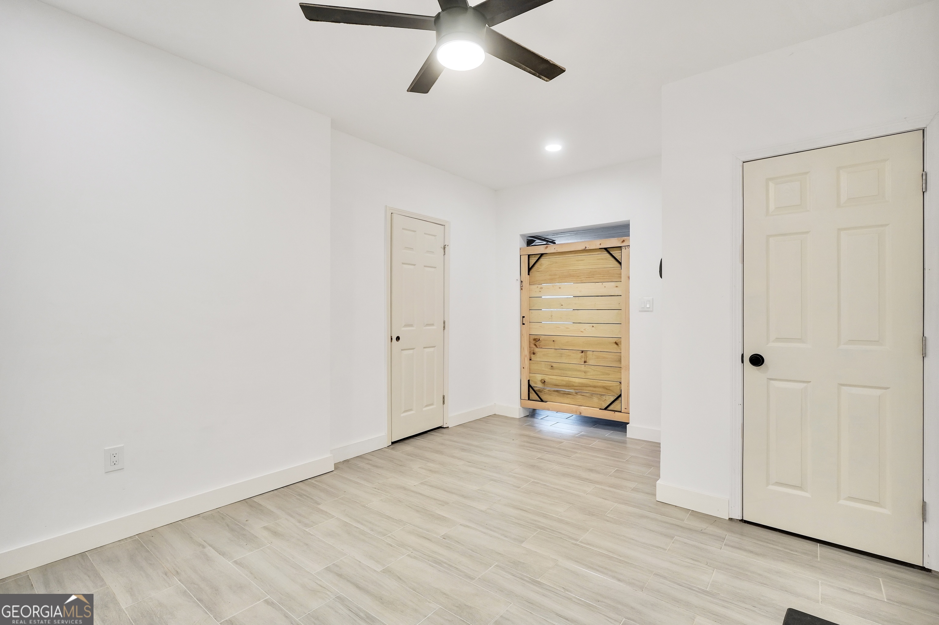 261 Highway 85 Connector Brooks, GA 30205 - Photo 56 of 73 wooden floor in an empty room with a window