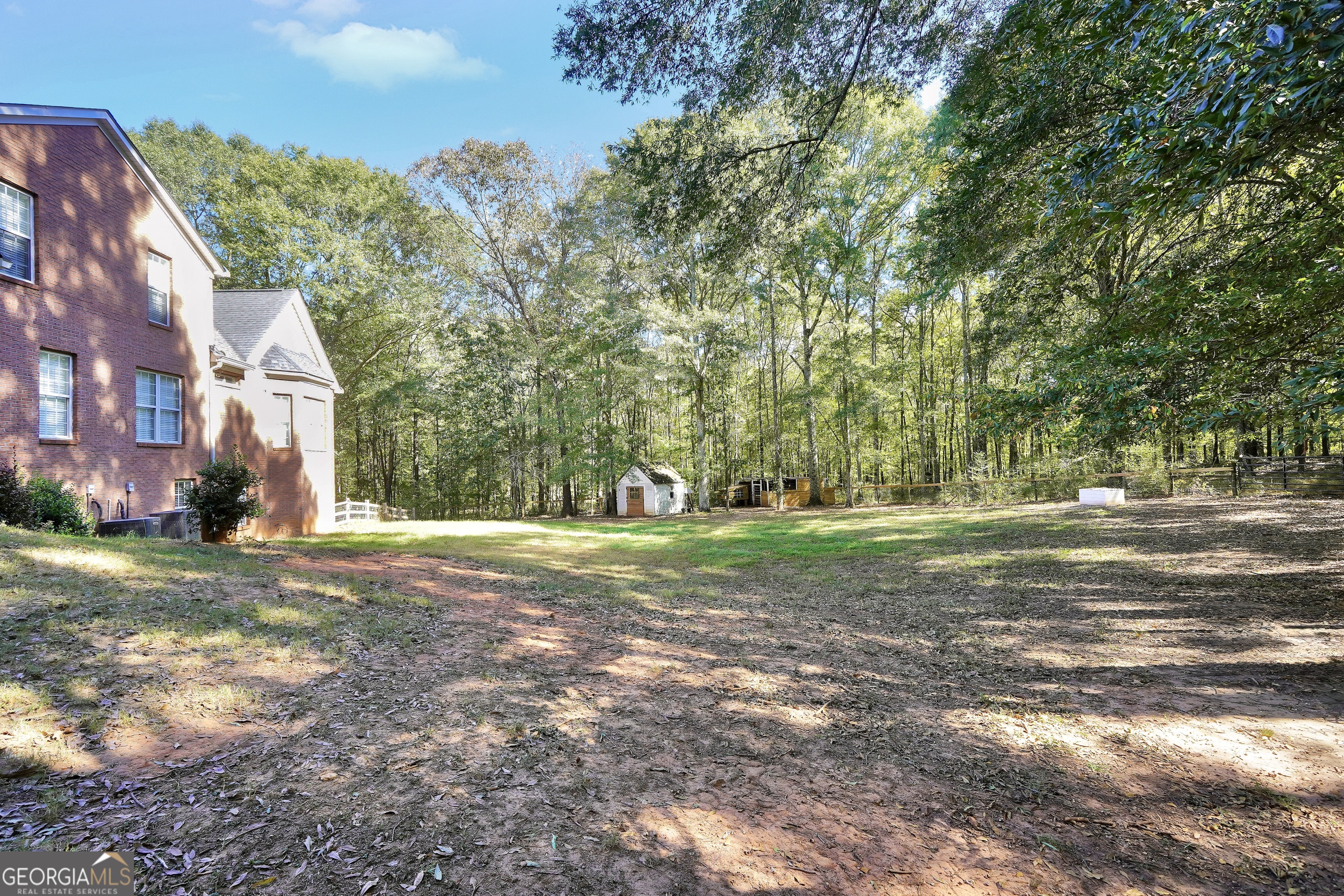 261 Highway 85 Connector Brooks, GA 30205 - Photo 65 of 73 a view of a house with a yard