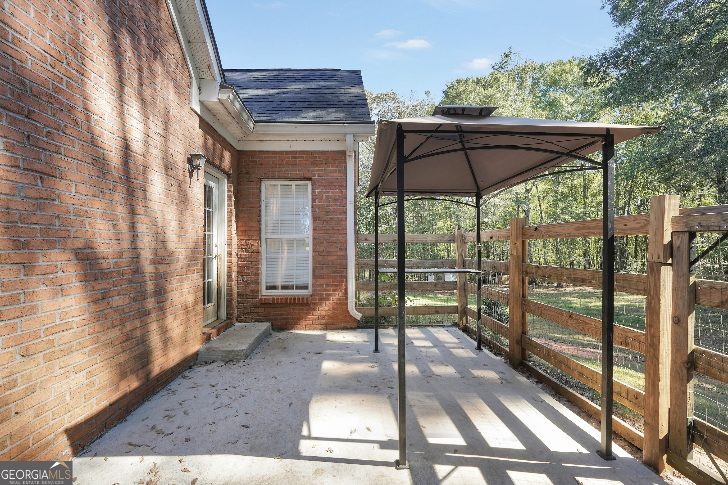261 Highway 85 Connector Brooks, GA 30205 - Photo 67 of 73 a view of a porch with a floor to ceiling window
