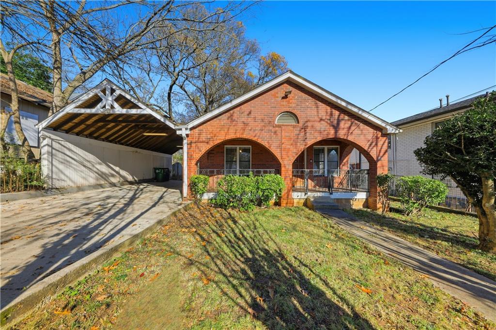 708 Bryan Street Southeast Atlanta, GA 30312 - Photo 1 of 1 a front view of a house with garden