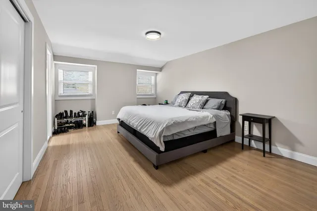 a bedroom with a bed and a table