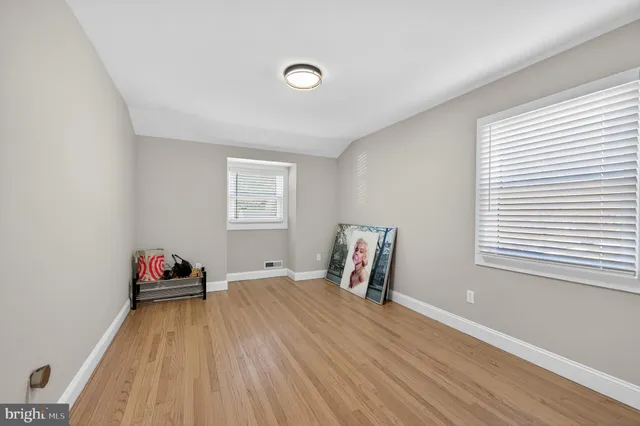 a room with a bed and a window