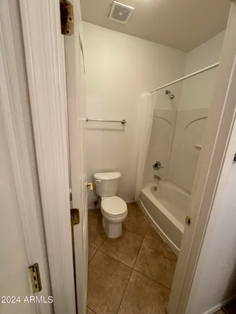 a bathroom with a sink a mirror and a toilet