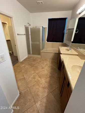 a view of kitchen with granite countertop sink and cabinets