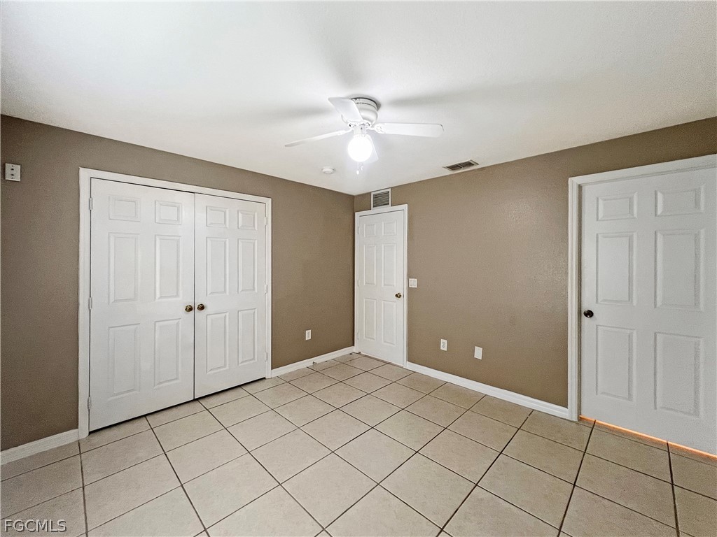 5231 27th Street Southwest Lehigh Acres, FL 33973 - Photo 11 of 22 a view of an empty room and closet area
