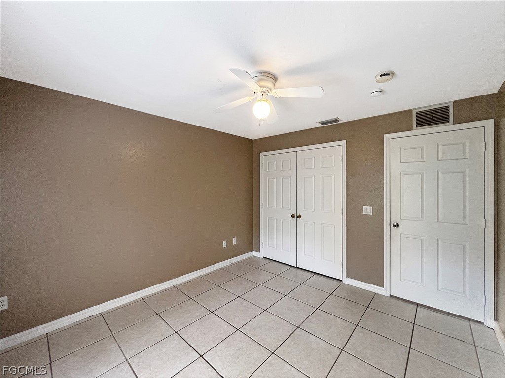 5231 27th Street Southwest Lehigh Acres, FL 33973 - Photo 14 of 22 a view of an empty room