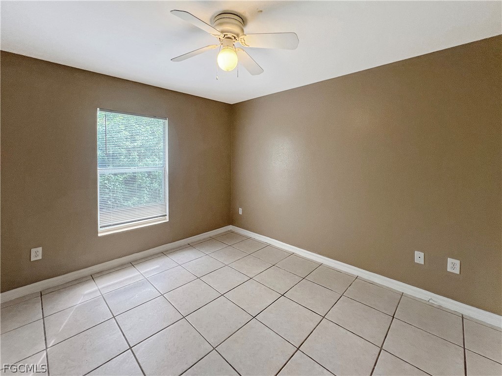 5231 27th Street Southwest Lehigh Acres, FL 33973 - Photo 15 of 22 a view of an empty room and window
