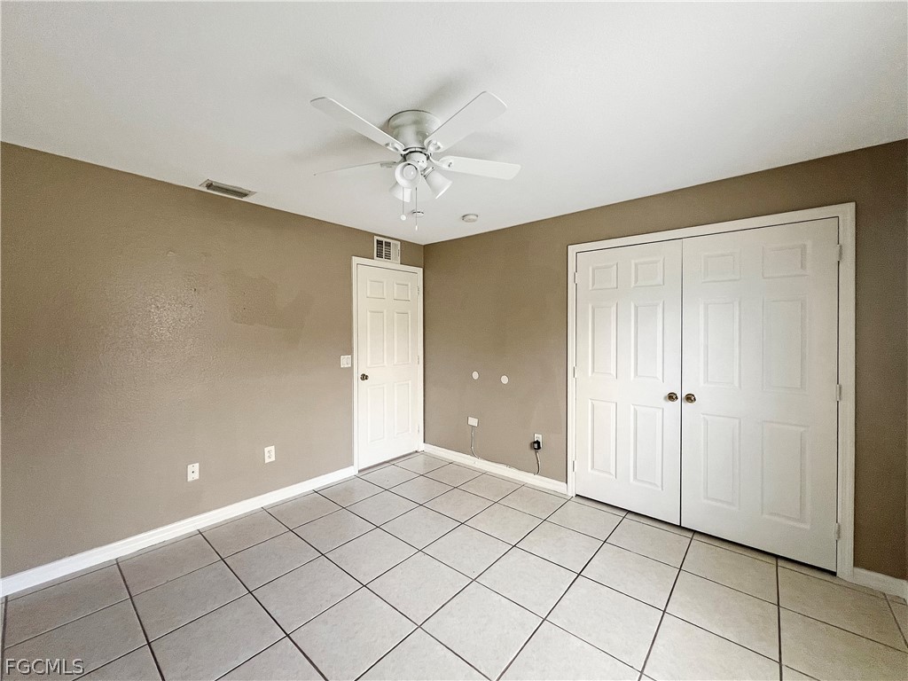 5231 27th Street Southwest Lehigh Acres, FL 33973 - Photo 17 of 22 a view of an empty room