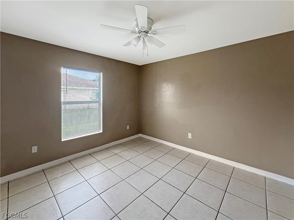 5231 27th Street Southwest Lehigh Acres, FL 33973 - Photo 18 of 22 a view of an empty room with a window