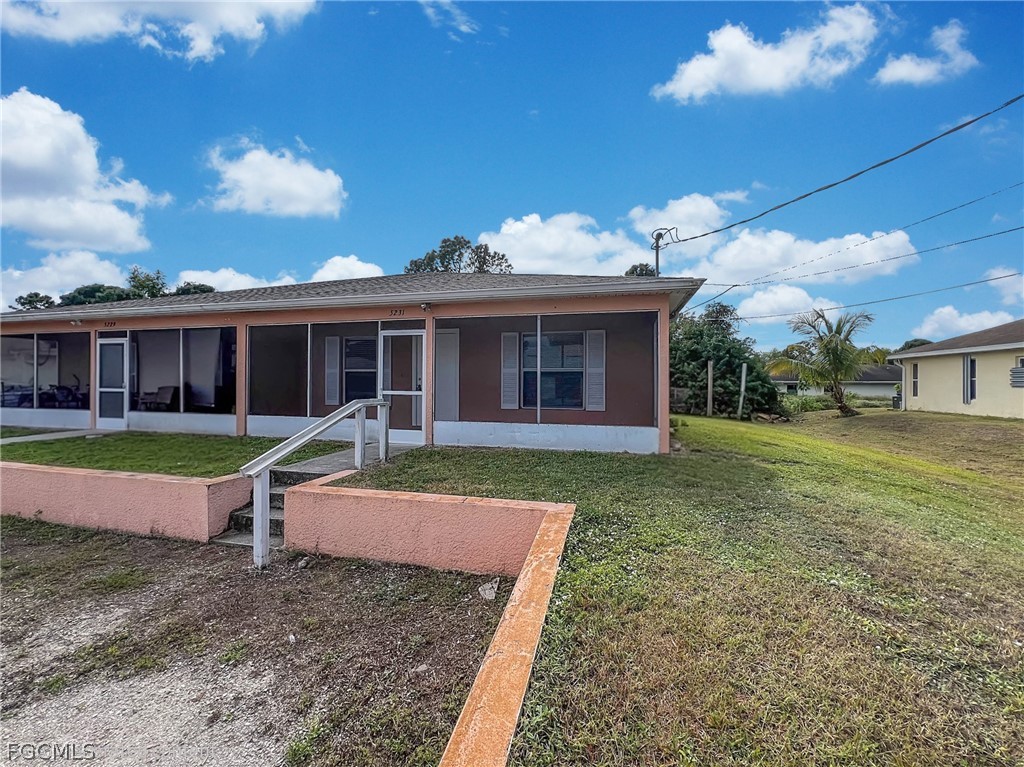 5231 27th Street Southwest Lehigh Acres, FL 33973 - Photo 3 of 22 a view of a house with a yard