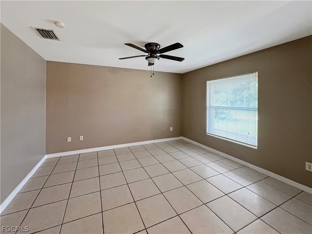 5231 27th Street Southwest Lehigh Acres, FL 33973 - Photo 6 of 22 a view of an empty room with a window