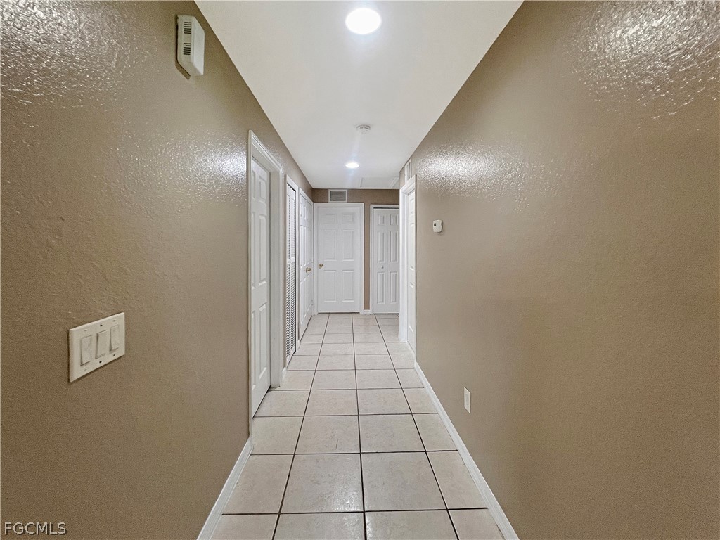 5231 27th Street Southwest Lehigh Acres, FL 33973 - Photo 10 of 22 a view of a hallway