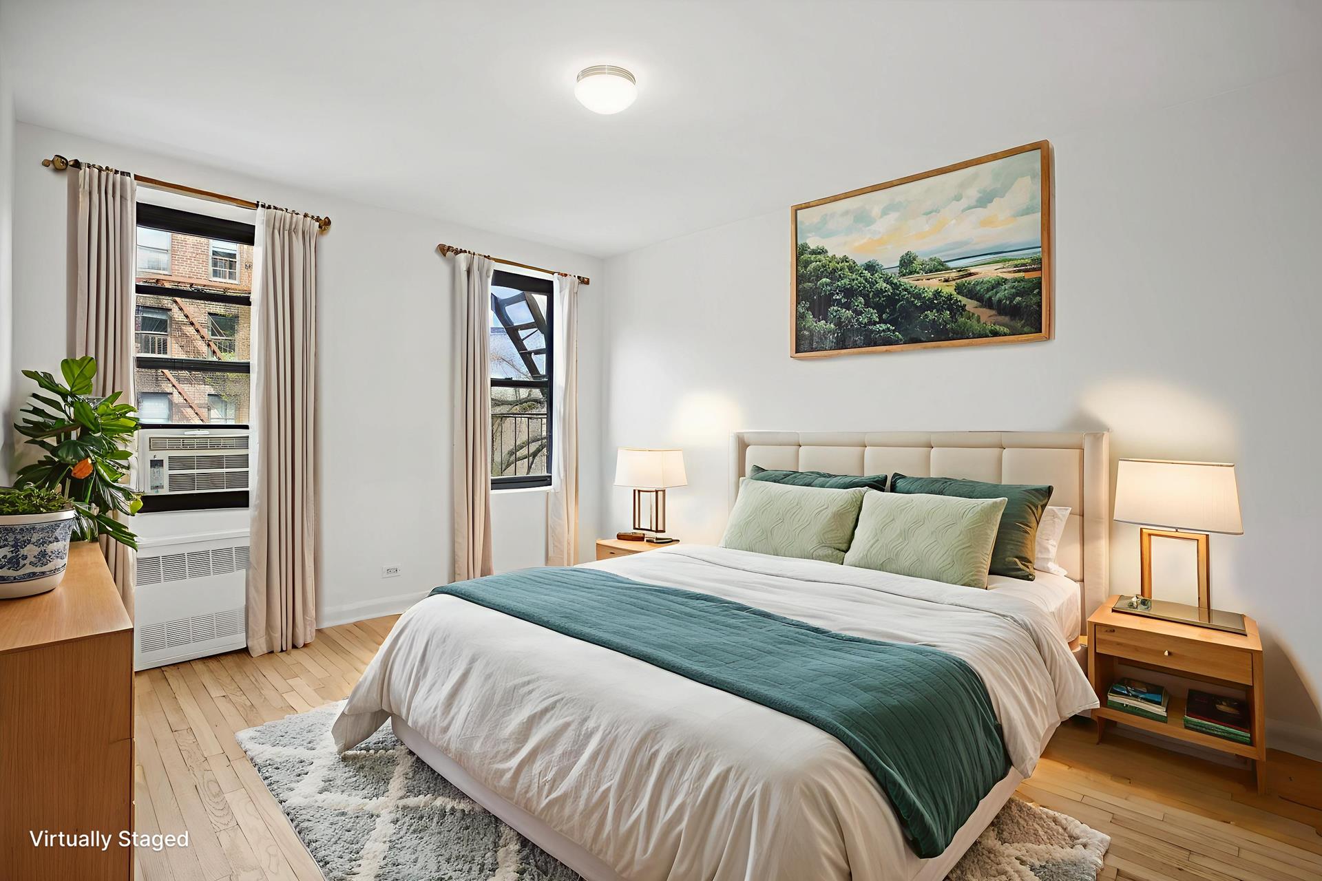 4489 Broadway, Unit 5E Manhattan, NY 10040 - Photo 7 of 13 a bedroom with a large bed and a window