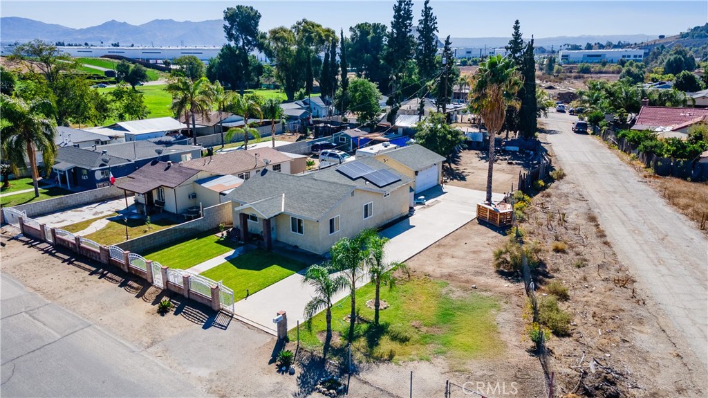 18859 6th Street Bloomington, CA 92316 - Photo 26 of 31 an aerial view of a house with a garden and swimming pool