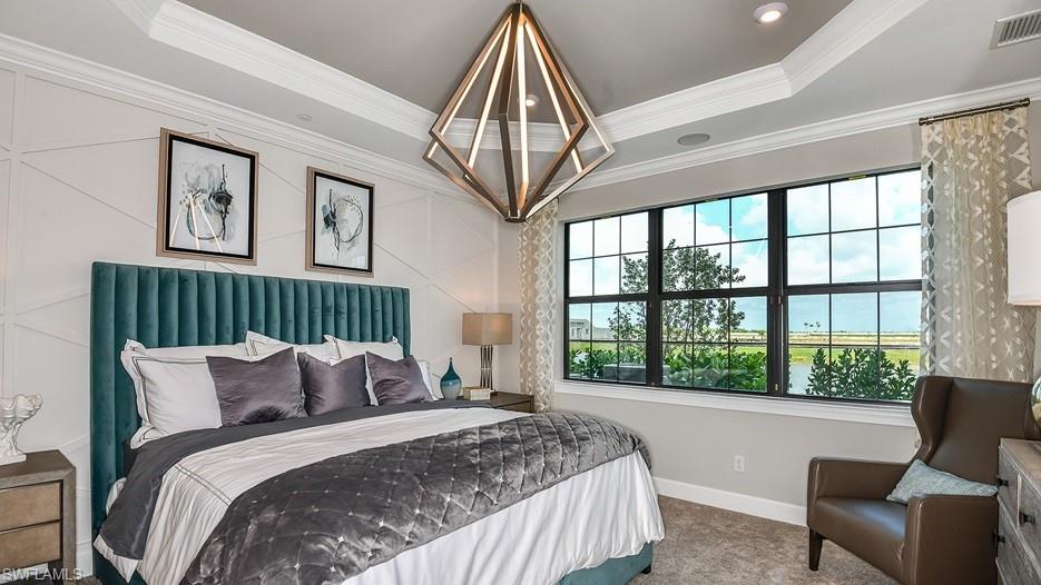 15336 Lucerna Street, Unit 101 Naples, FL 34114 - Photo 4 of 7 a bedroom with a bed and a large window