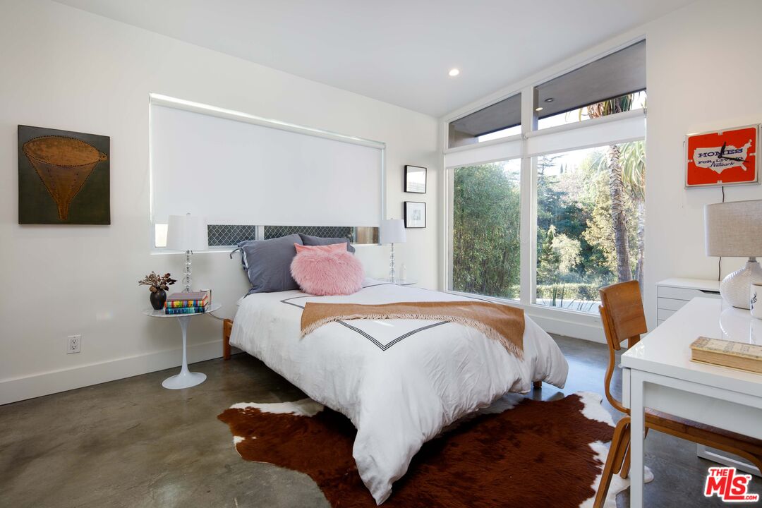 7500 Devista Drive Los Angeles, CA 90046 - Photo 23 of 41 a bedroom with bed and glass window