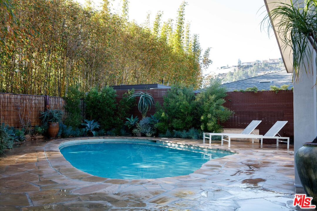 7500 Devista Drive Los Angeles, CA 90046 - Photo 5 of 41 a view of a swimming pool with a patio