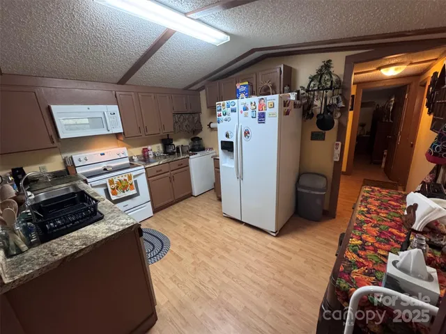 a bedroom with furniture and large windows