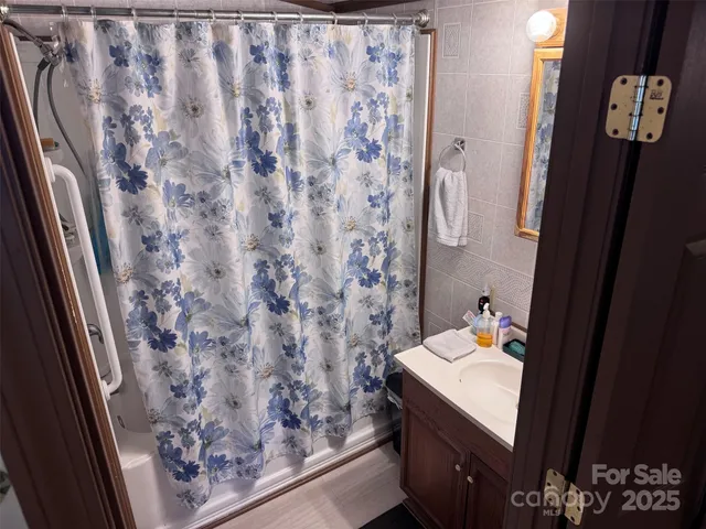 a bedroom with a bed and furniture