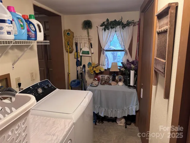 a view of a small house with backyard